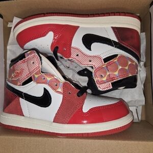 Red and White High-Top Sneakers with Black Accents‎